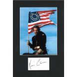 Kevin Costner signature piece mounted below colour photo. Approx overall size 16x10. Good Condition.