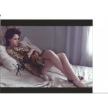 Kristen Stewart signed 10x8 colour photo. American actress and director. She is the recipient of