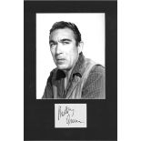 Anthony Quinn signature piece mounted below b/w photo. Approx overall size 16x11. Good Condition.