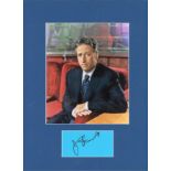 Jon Stewart signature piece mounted below colour photo. Approx overall size 16x12. Good Condition.