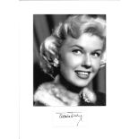 Doris Day signature piece mounted below b/w photo. Approx overall size 14x12. Good Condition. All