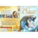 Dakota Blue Richards and Freddie Hymore signed The Golden Compass. Signed on the front cover of