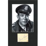 Ward Bond signature piece mounted below b/w photo. Approx overall size 16x12. Good Condition. All