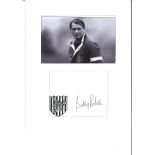 Bobby Robson signature piece mounted below black and white photo of the England manager. Approx.