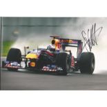 Sebastian Vettel signed 12x8 colour photo racing for Red bull. Good condition Est.