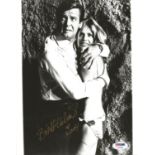 Film and TV Britt Ekland 10x8 signed b/w photo pictured with Roger Moore in the Man with the