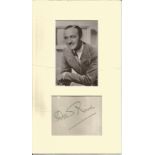 David Niven signature piece mounted below black and white photo. Approx. overall size 12x7. 1