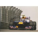 Mark Webber signed 12x8 colour photo racing for Red Bull. Good condition Est.
