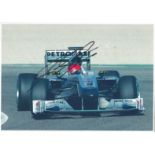 Michael Schumacher signed 12x8 colour photo. Slight mark on photo but not affecting signature.