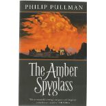The Amber Spyglass softback book signed on the inside title page by the author Philip Pullman.548