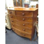 A large Victorian mahogany bow front chest of two short and four long graduated drawers with