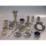 A quantity of silver mustards, napkin rings and other small silver