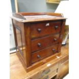 A mid-Victorian tabletop Wellington chest with drawers and locking stile, 48cm high 47 wide 32cm