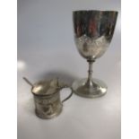 A Victorian silver wine goblet and a Victorian silver mustard pot with blue glass liner and later