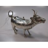 A Continental silver cow creamer with hinged saddle and raised tail, stamped 'Sterling 925' 3.3ozt