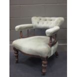 A late Victorian upholstered tub chair together with an oval wall mirror (2)