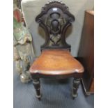 A pair of mid Victorian mahogany hall chairs (2)