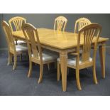 A 20th century ash veneered and inlaid refectory table with two extra leaves and six chairs (7)