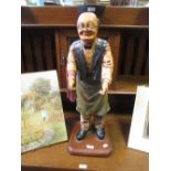 A painted standing inn keeper type figure and two wooden wine boxes etc