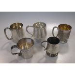 Five various silver christening and other mugs, 27oz