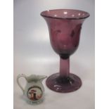 An amethyst coloured vase with bud shape bowl, on twist stem and circular foot, 24cm high, and a