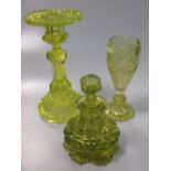 Uranium glass, to include two candlesticks, a pair of inkwells and a pair of vases