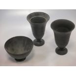 A pair of Wedgwood black basalt bell shaped vases, 18.5cm high together with a similar bowl (3)