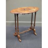 A Victorian walnut oval table on turned legs and outswept feet, and an oak framed firescreen with