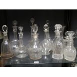 A collection of 19th century and later glass decanters and stoppers to include a pair of triple ring