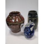 A collection of ceramics to include two Japanese stoneware vases, 2 jugs, and a glazed pottery