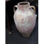 A Mediterannean pottery twin handled storage jar, 64cm high