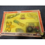 Britains; A 9592 Farm Tractor and implement set, four 4703 pig sty sets, 9629 rear dump, 4381 zoo