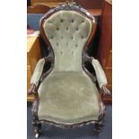 A Victorian button upholstered open arm easy chair, upholstered in grey material, with ornamental