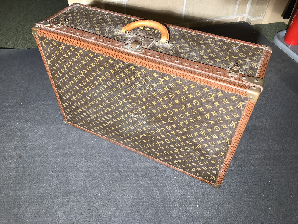 Louis Vuitton, a large monogrammed canvas and leather suitcase, late 20th century, opening to reveal - Image 9 of 11