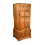 Peter Waals (1870-1937), a good walnut gentleman's single wardrobe or compactum, designed by Hugh