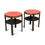 A pair of oak veneered and black lacquer occasional tables, the red formica circular tops raised