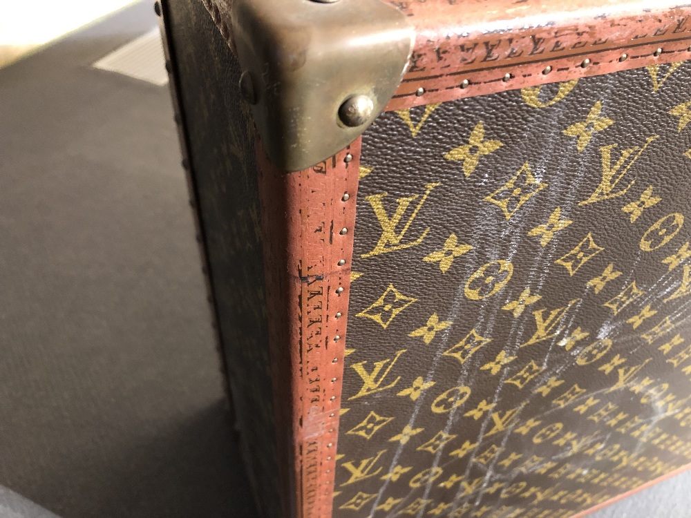 Louis Vuitton, a large monogrammed canvas and leather suitcase, late 20th century, opening to reveal - Image 2 of 11