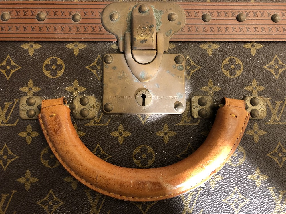 Louis Vuitton, a large monogrammed canvas and leather suitcase, late 20th century, opening to reveal - Image 4 of 11
