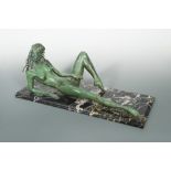 § Tom Merrifield, (British, born 1932), reclining nude, bronze, with green patina and mounted to a