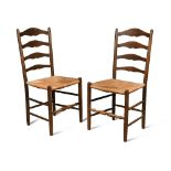 Edward Gardiner, a pair of stained ash ladder back chairs, circa 1920, the shaped ladder backs above