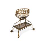 An early 20th century gilt painted wrought iron jardiniere, the oval basket with ring handles