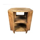 A Heal's style Art Deco oak book table, with octagonal shaped oak top supported by four canted sides