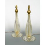 A pair of Seguso Murano glass table lamps, each of fluted baluster form to a spreading foot with