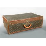 Louis Vuitton, a large monogrammed canvas and leather suitcase, late 20th century, opening to reveal