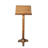 A Gothic oak lectern, the rectangular reading stand supported on a chip carved and octagonal