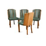 A set of four Art Deco walnut dining chairs, the shaped backs and seats in green vinyl upholstery,