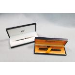 A boxed Mont Blanc 'Classique' ball point pen, in black with gilt detailing, together with a boxed