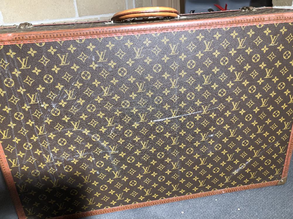 Louis Vuitton, a large monogrammed canvas and leather suitcase, late 20th century, opening to reveal - Image 10 of 11