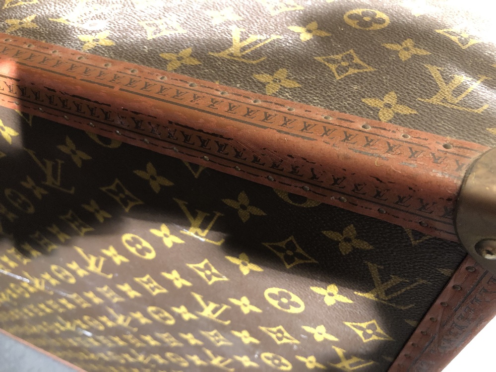 Louis Vuitton, a large monogrammed canvas and leather suitcase, late 20th century, opening to reveal - Image 11 of 11