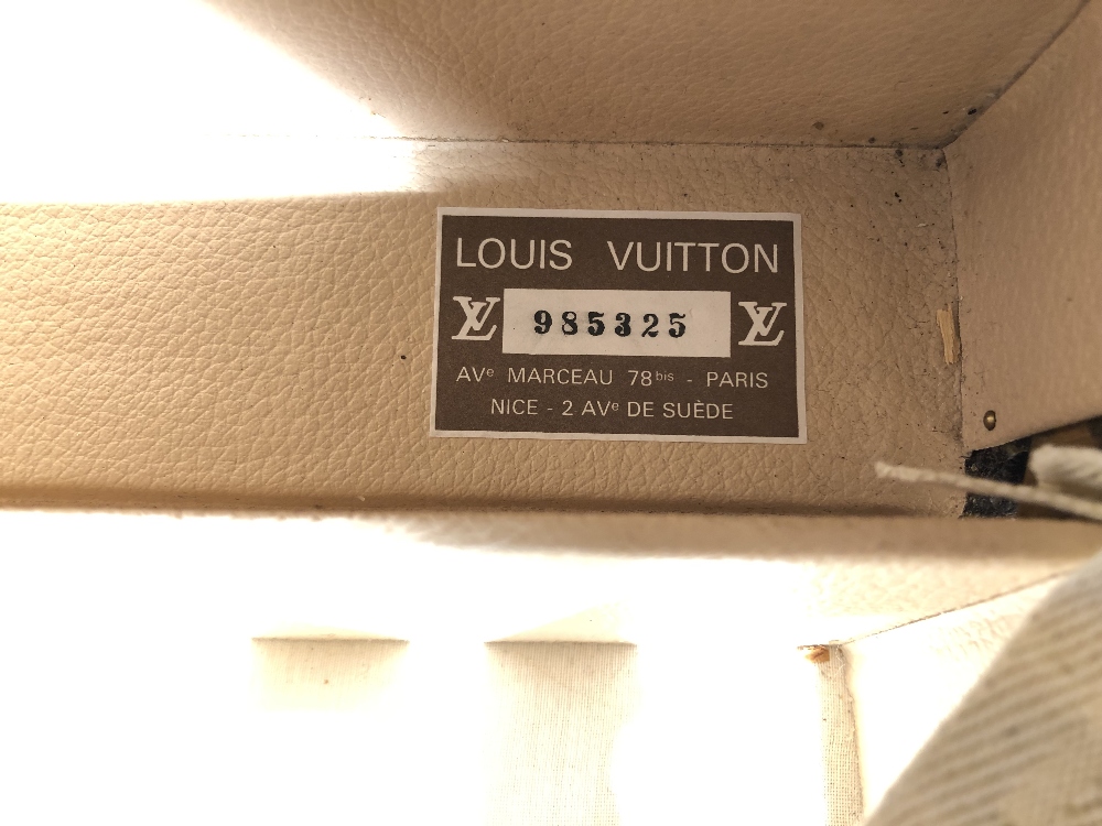 Louis Vuitton, a large monogrammed canvas and leather suitcase, late 20th century, opening to reveal - Image 6 of 11